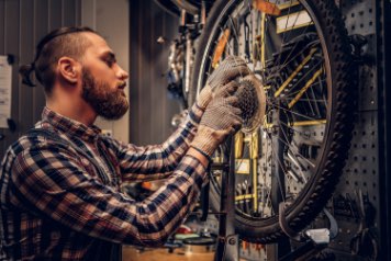 person fixing bike at the best bike shop in town